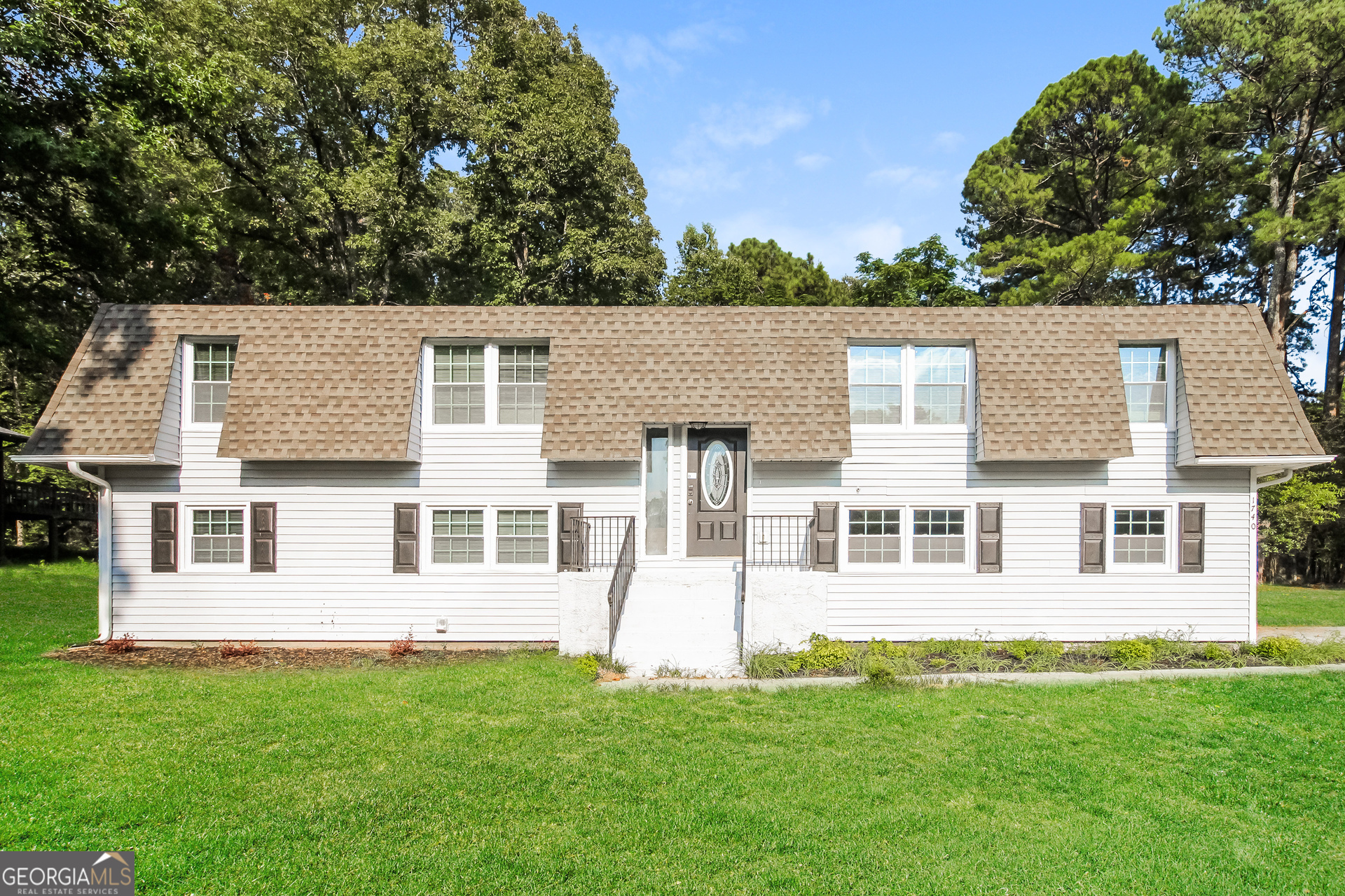 front view of a house with a yard