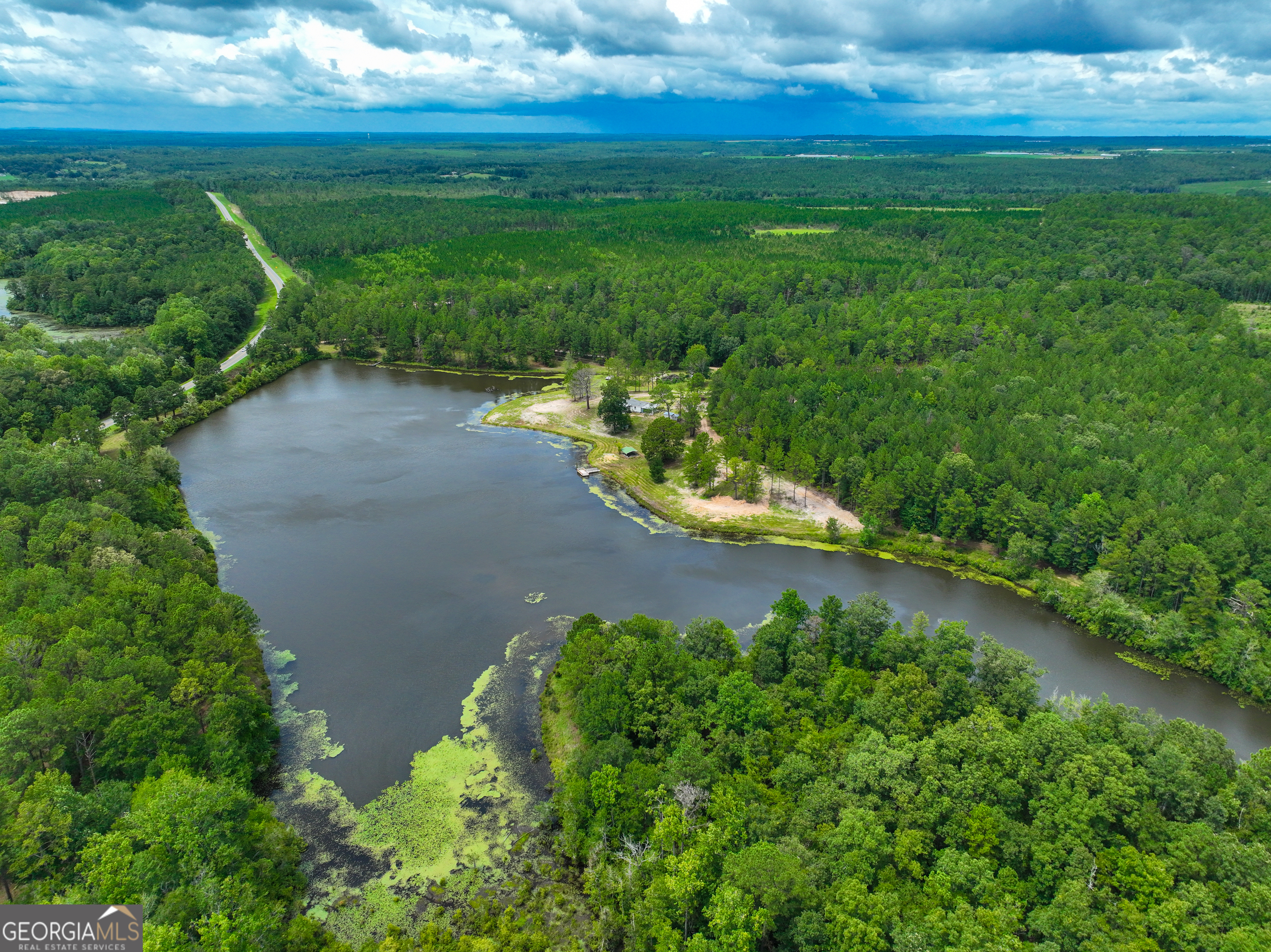 a view of a lake with a yard