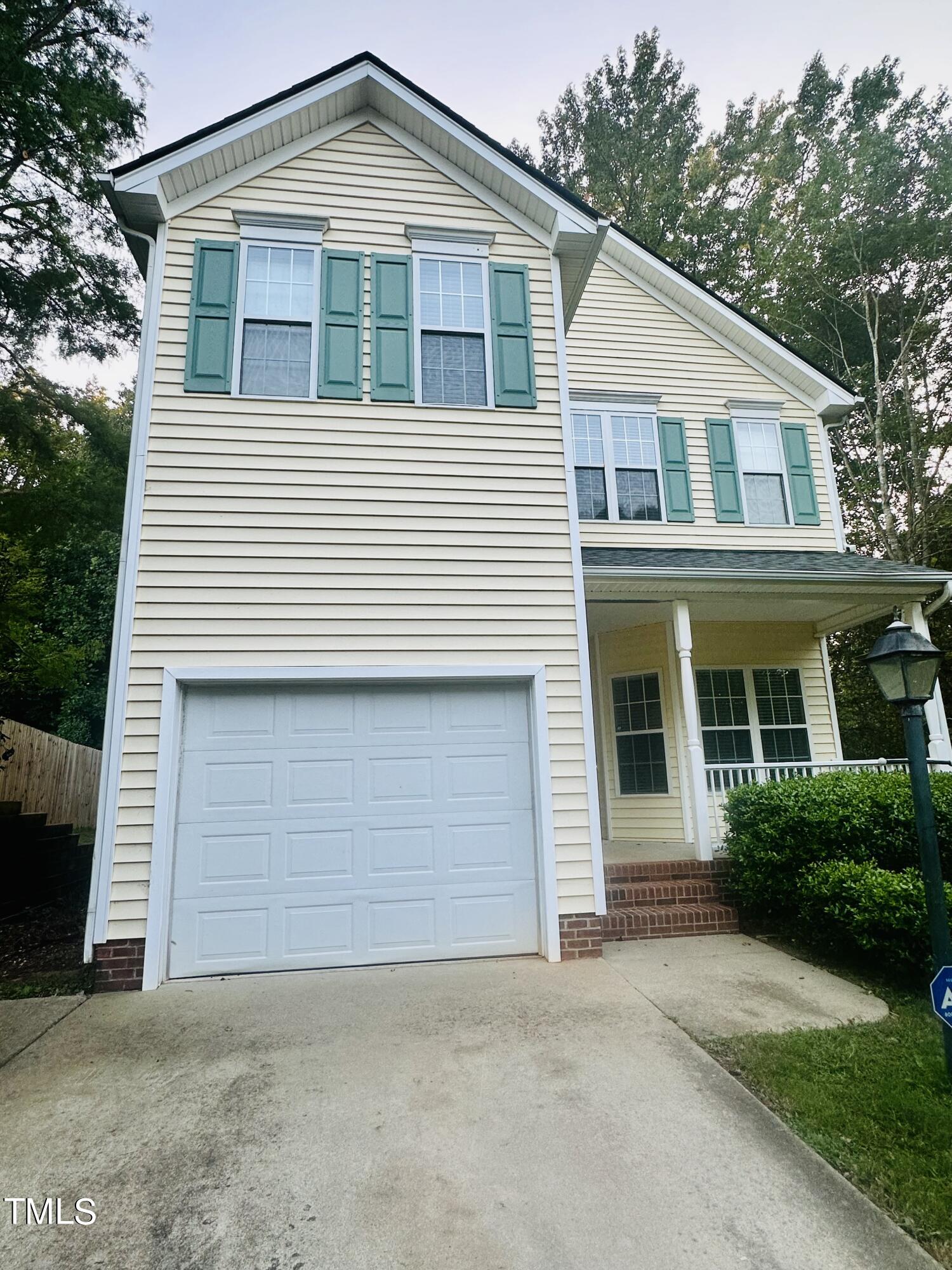 a front view of a house with a garage