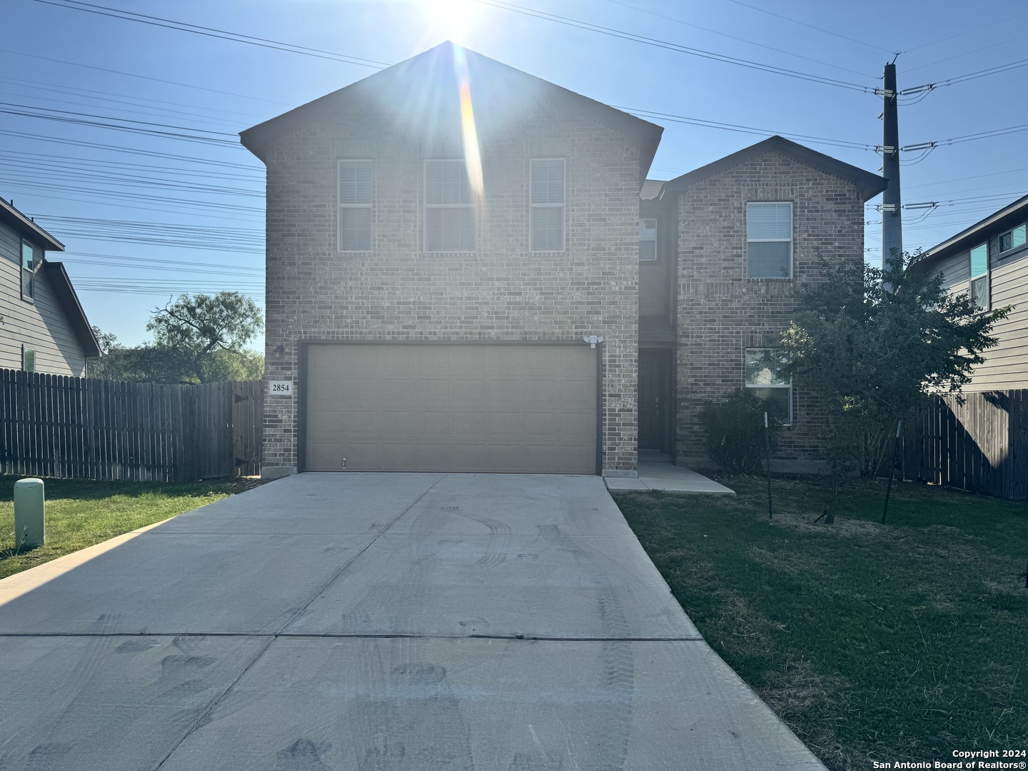 a view of backyard of house with garage