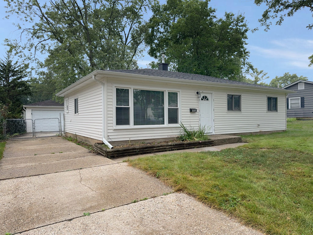 a house with yard in front of it