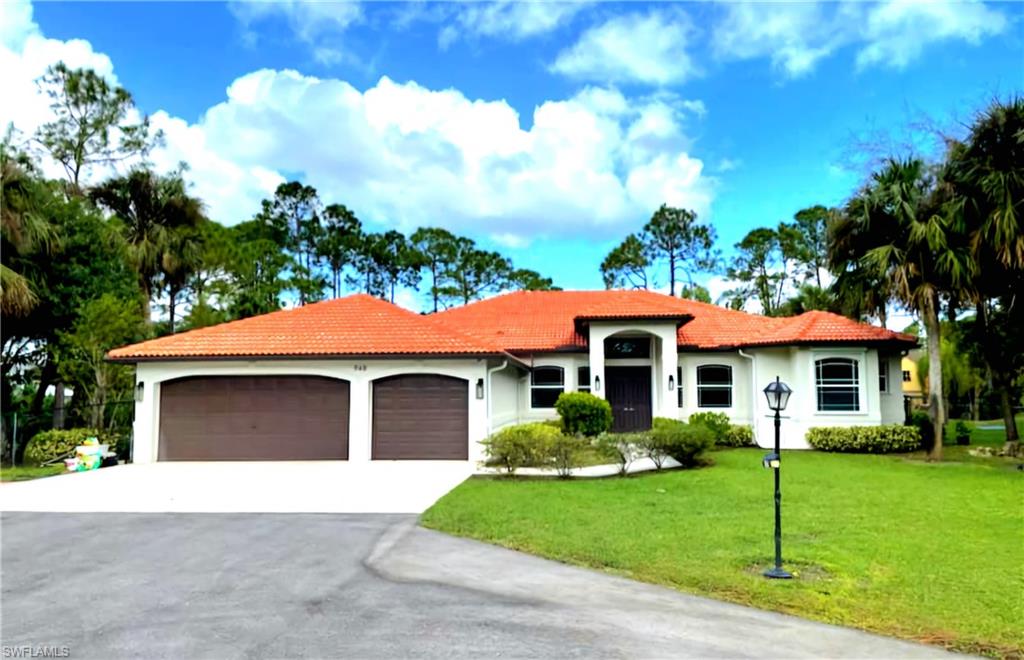 a front view of a house with a yard