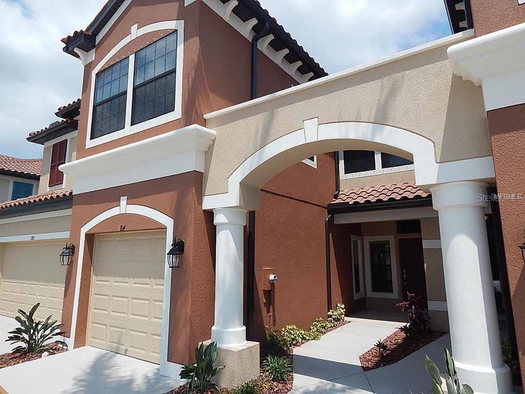 a front view of a house with a garage