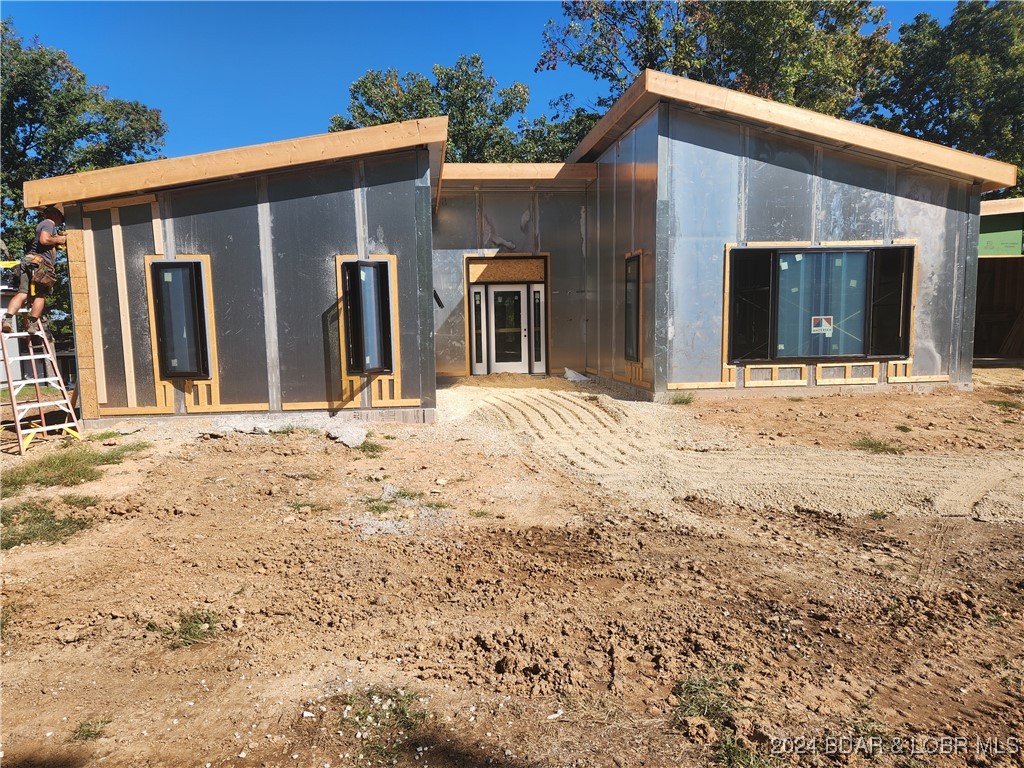 Front of house-Entry is center, right garage & lef