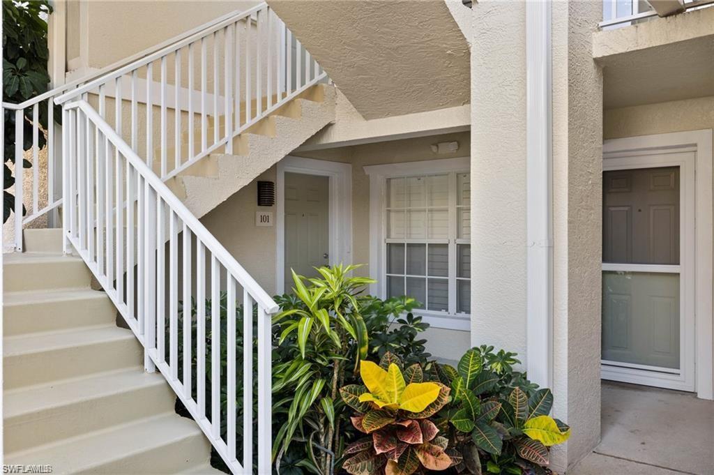 a view of staircase with wooden floor and a potted plant