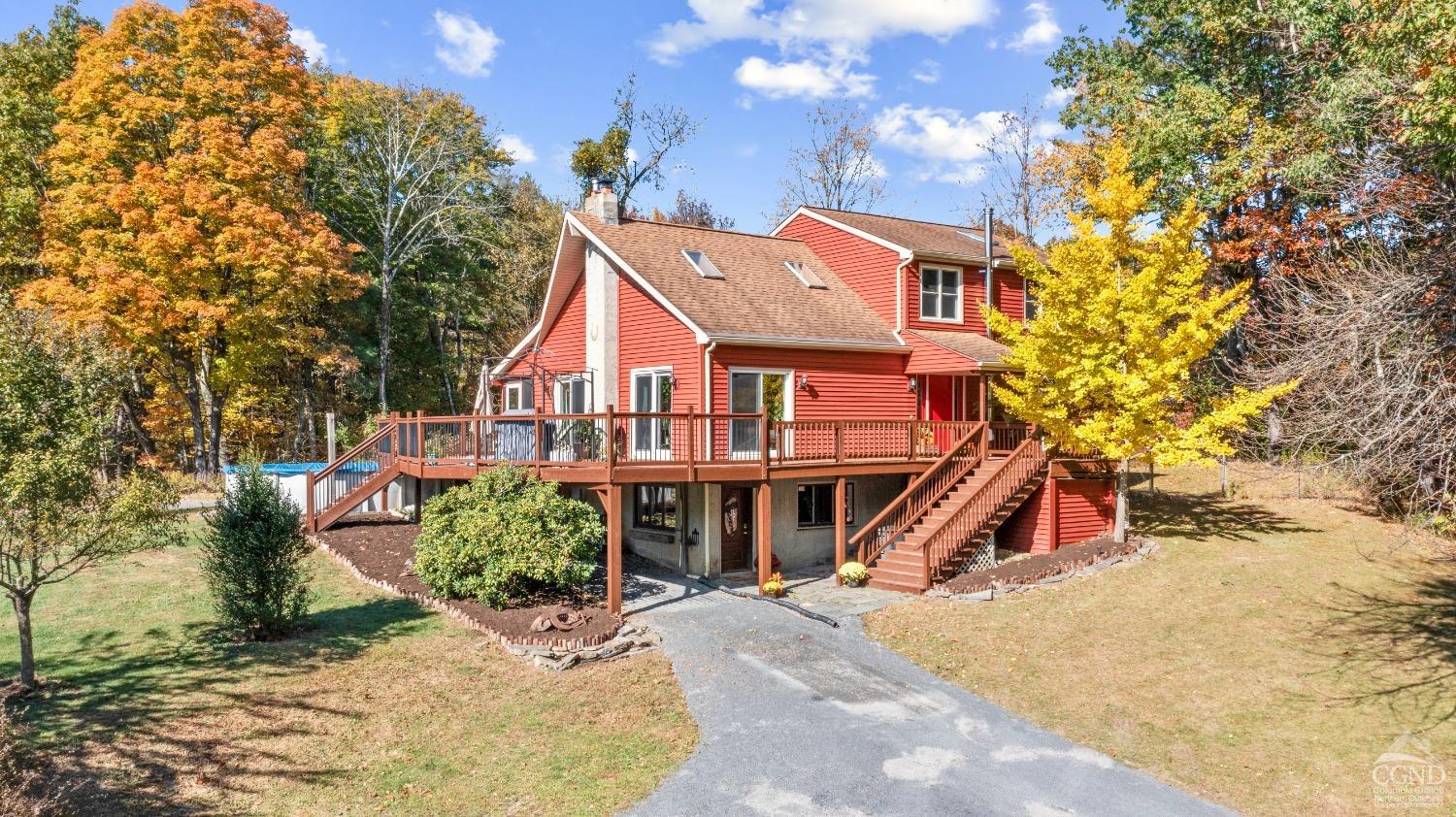 a view of a house with basketball court