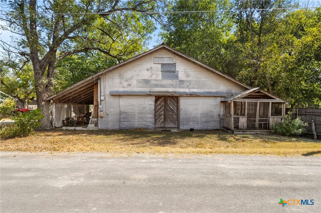 a view of a house with swimming pool in front of it