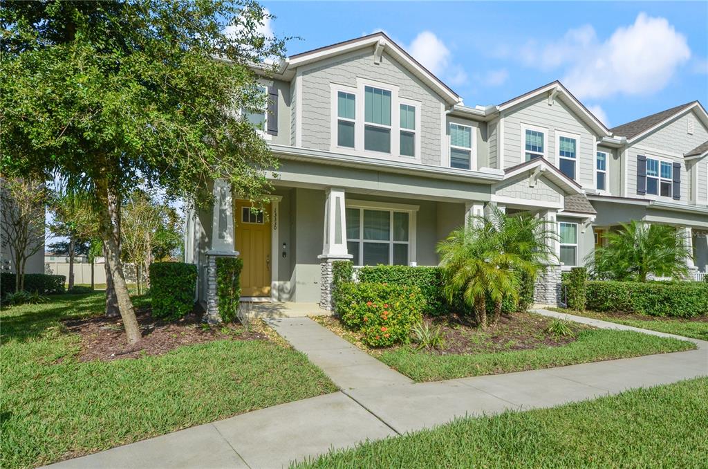 a front view of a house with a yard