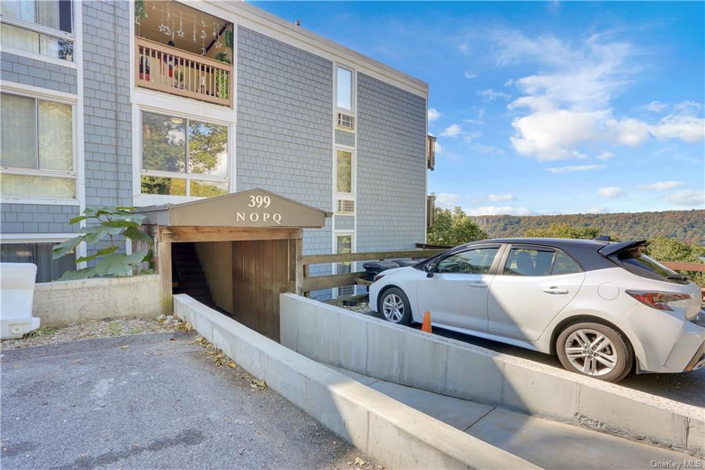 a view of a car parked in front of a house