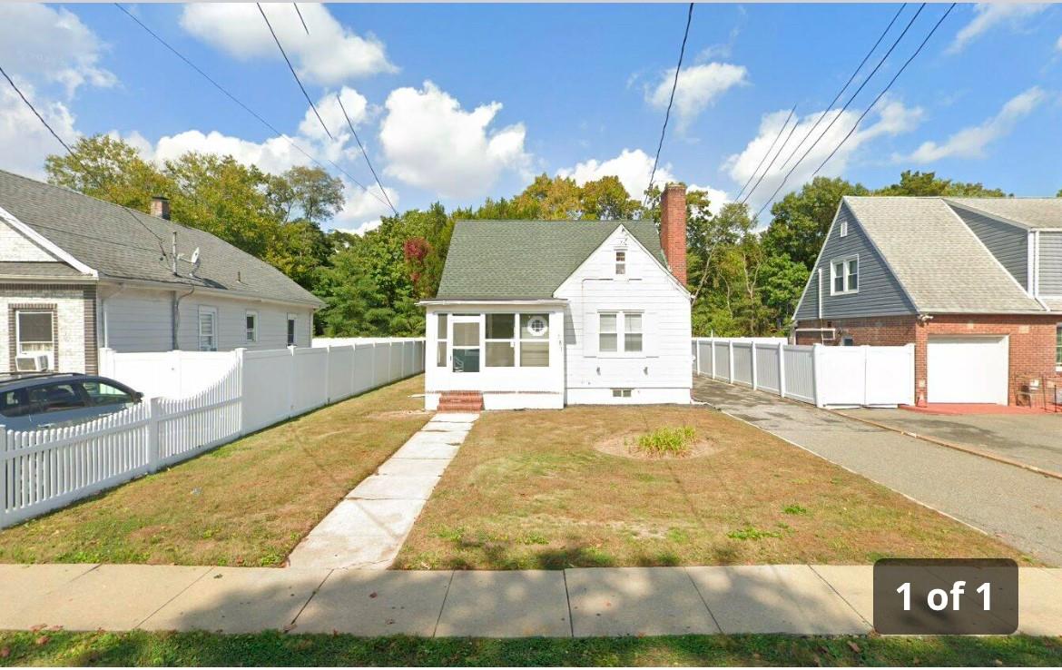 a view of house with yard