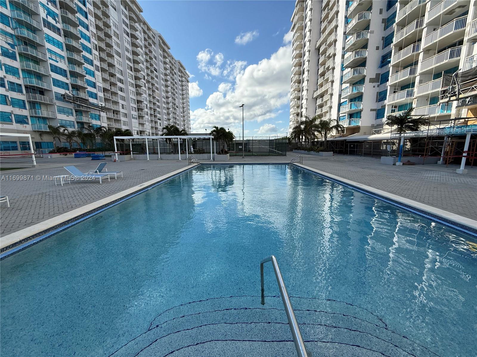 a view of outdoor space with swimming pool