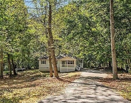 a view of a house with a tree