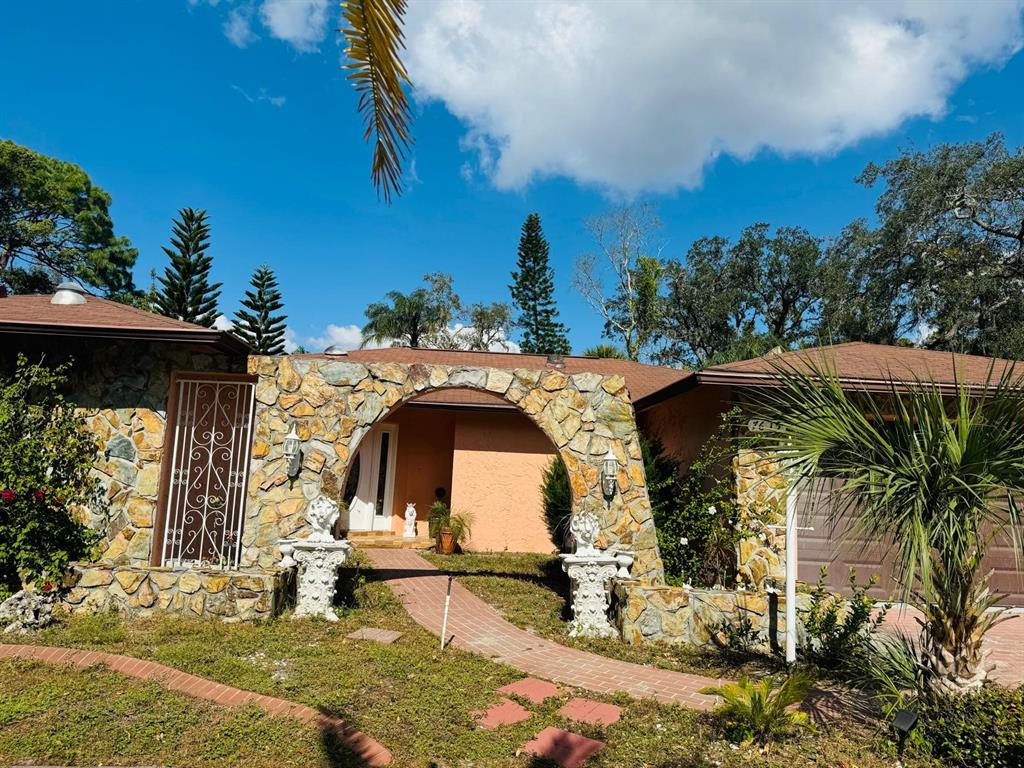 a front view of a house with garden