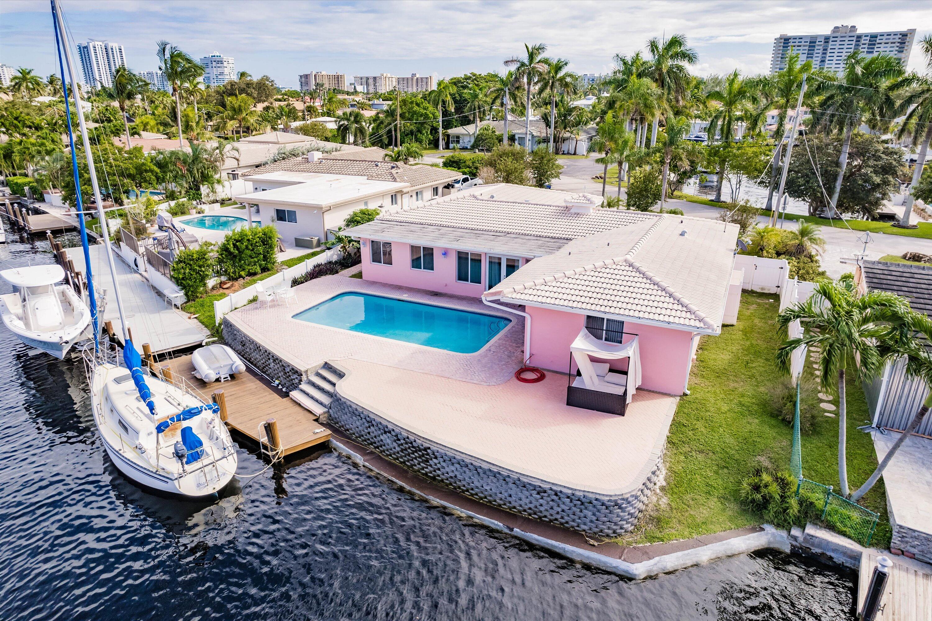 an aerial view of a house with outdoor space