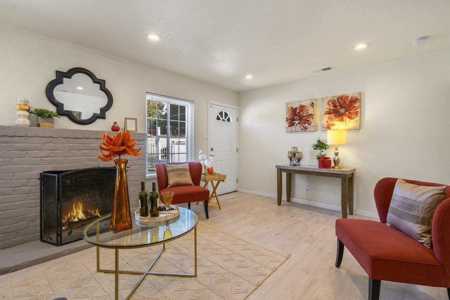 a living room with furniture and a fireplace