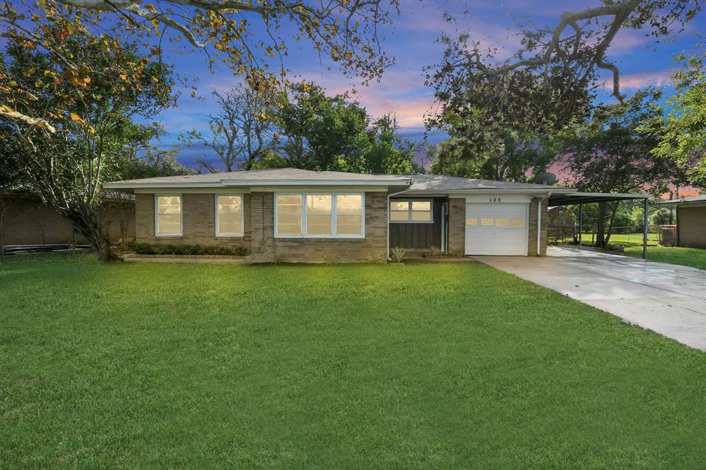 a view of a house with a backyard