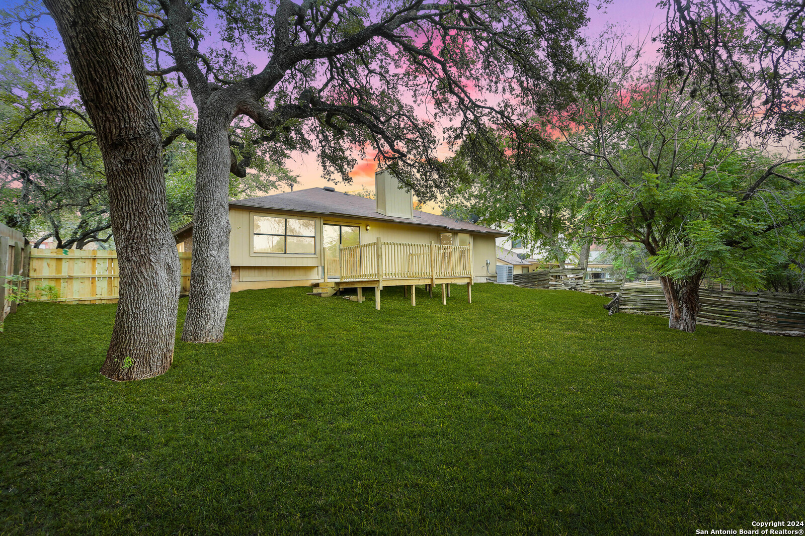 a view of an house with backyard space and garden