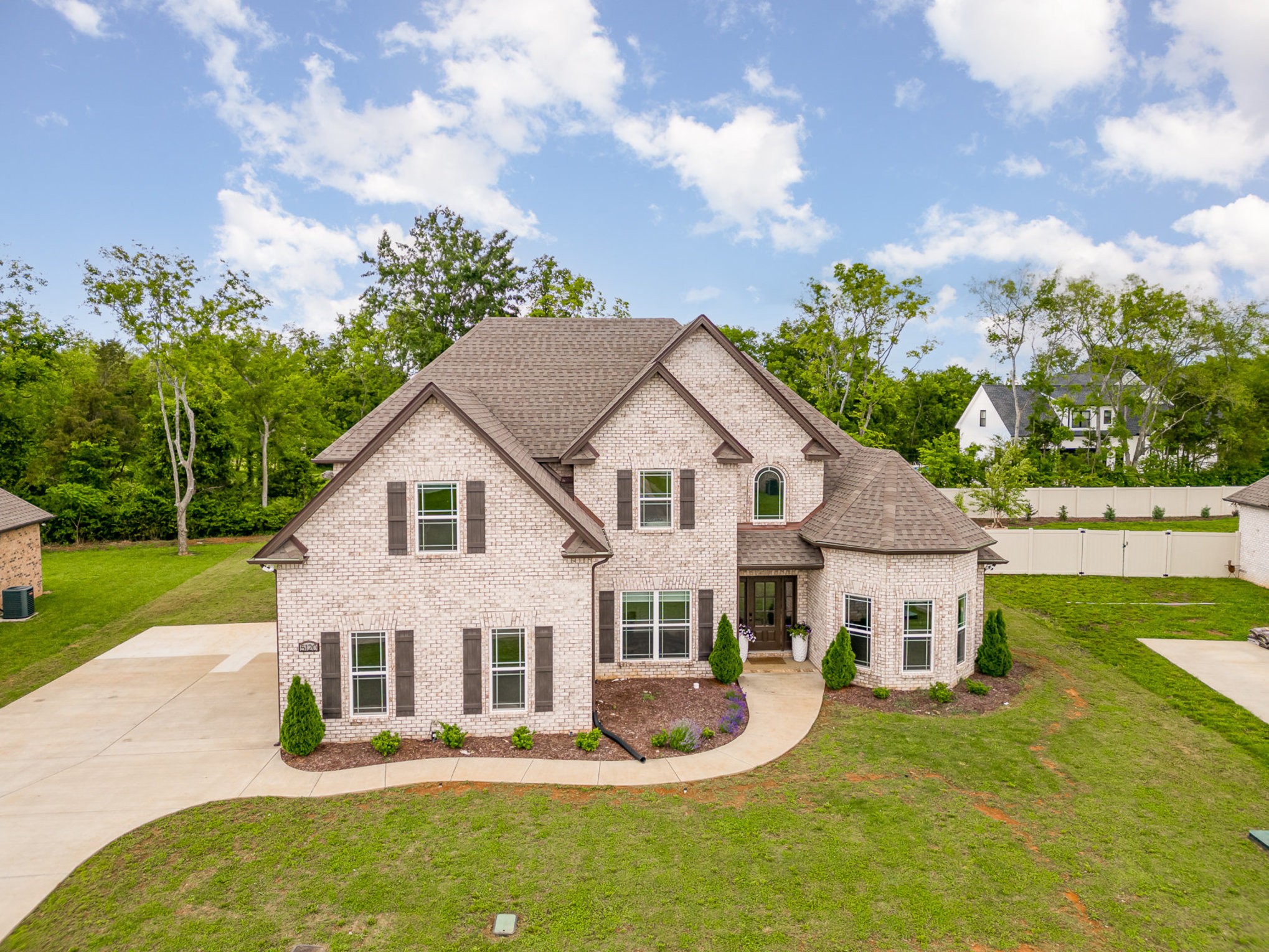 a aerial view of a house with swimming pool and garden