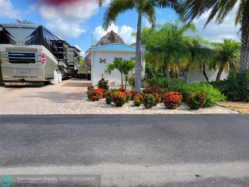 a view of car parked in front of a house