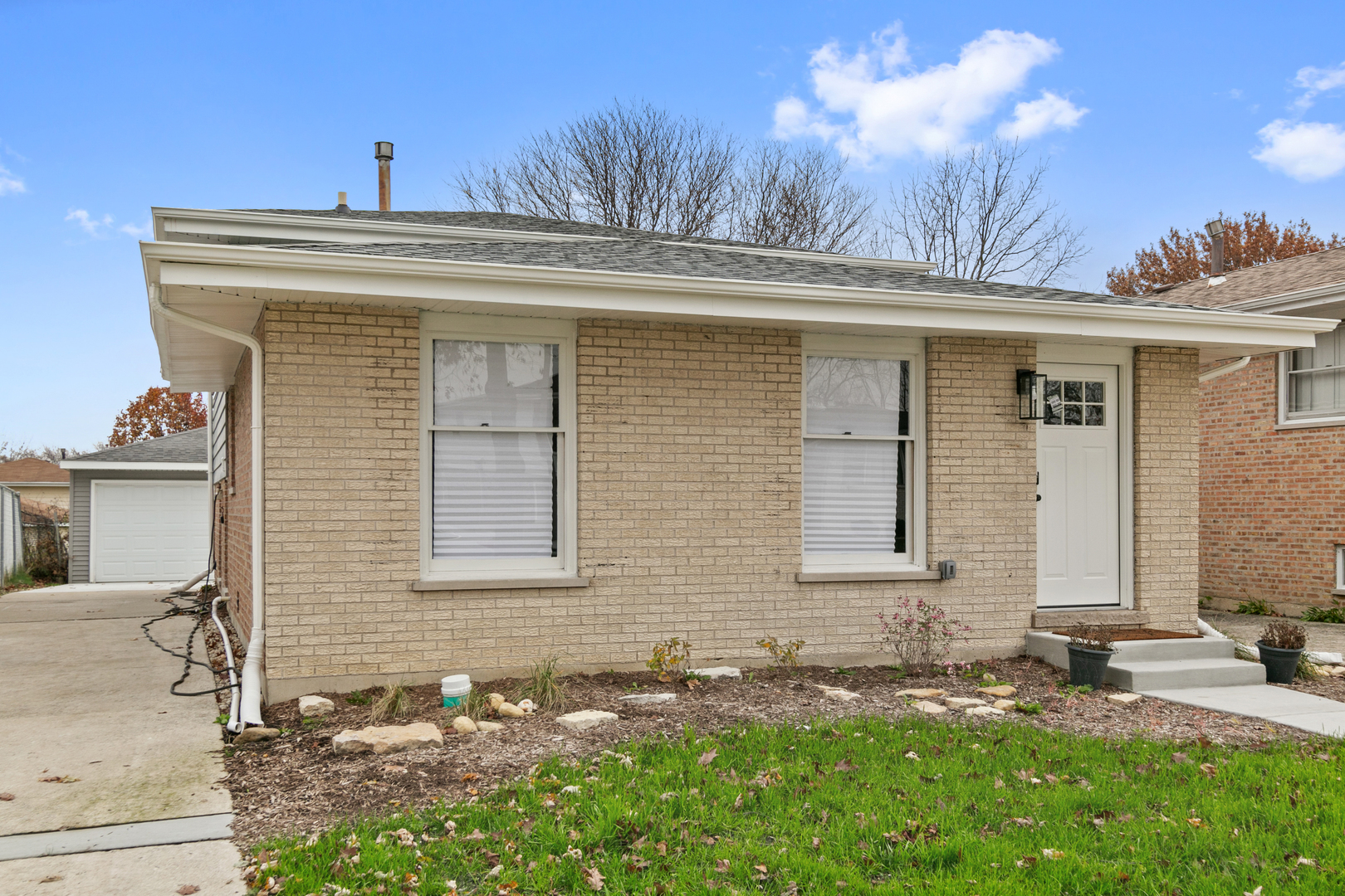 a front view of a house with a yard