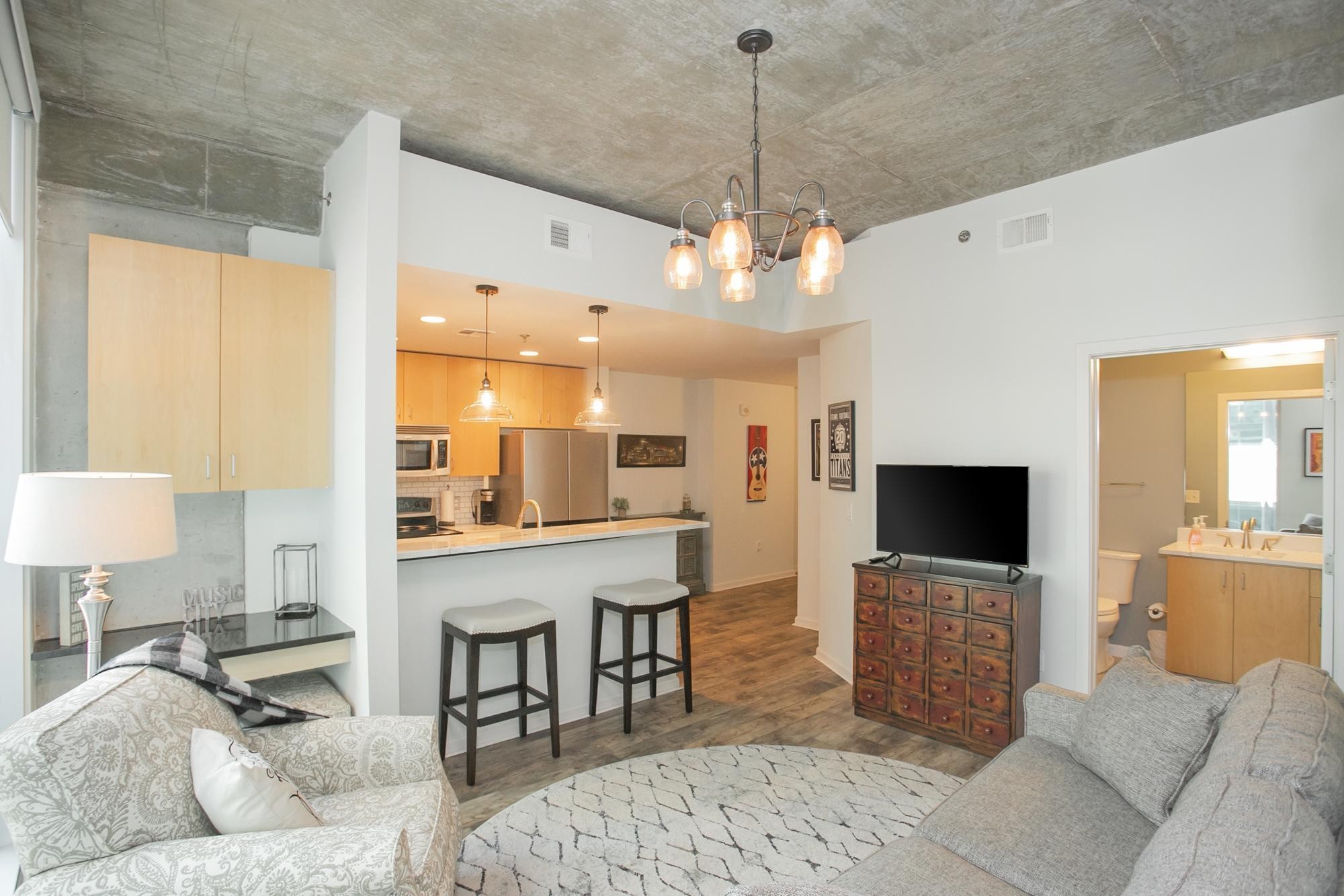 a living room with furniture and a flat screen tv