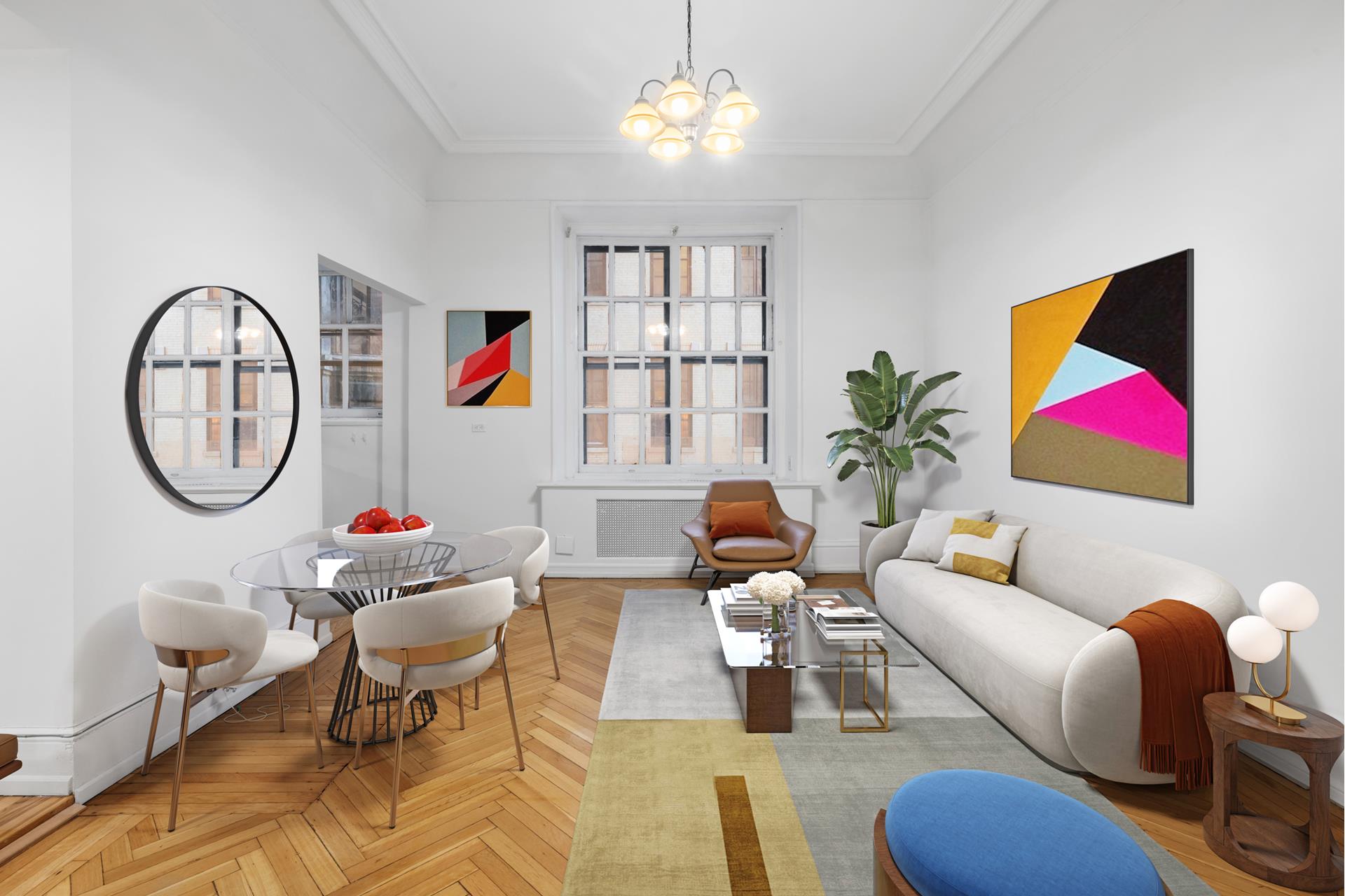 a living room with furniture a rug and a chandelier