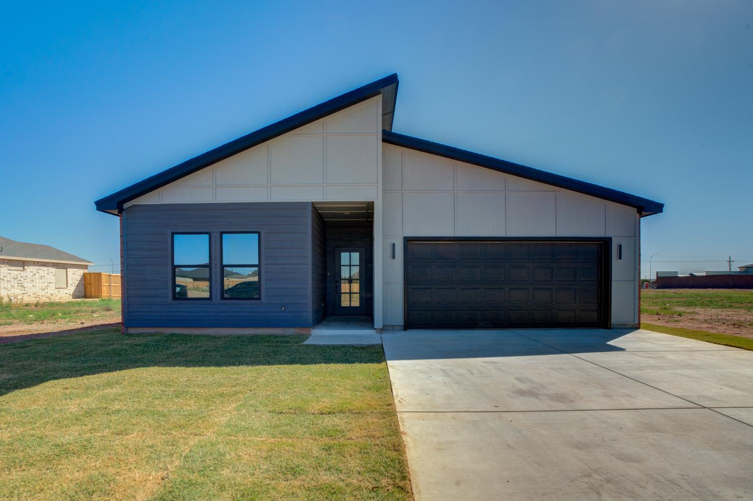 a front view of a house with yard