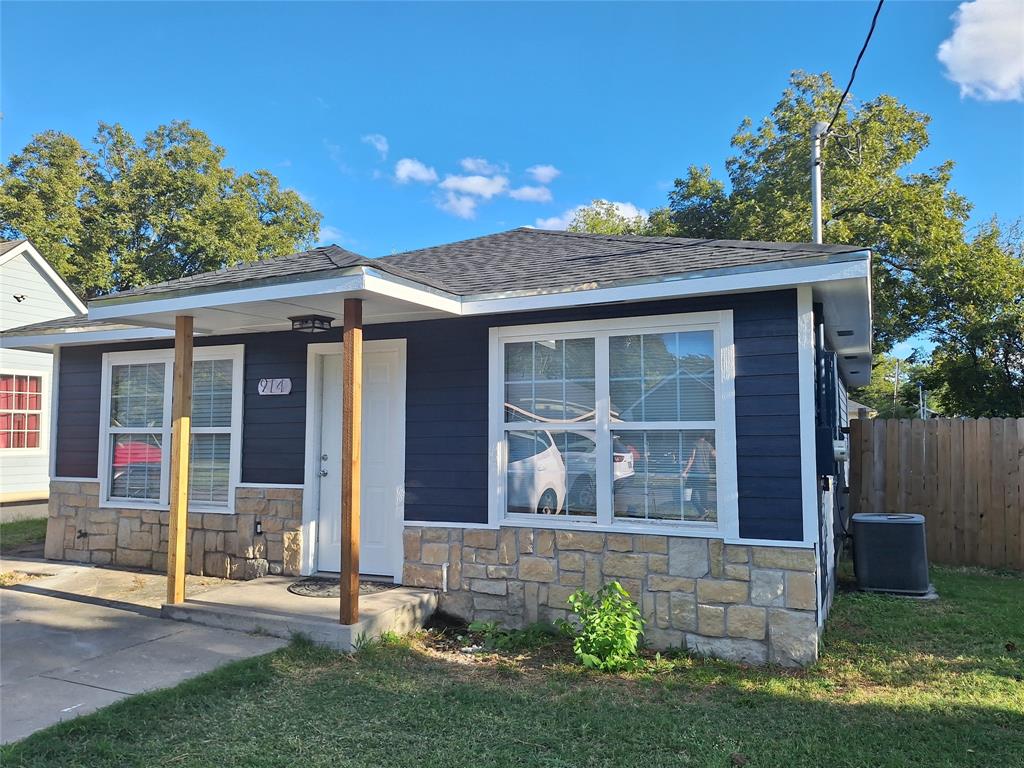 front view of a house with a yard