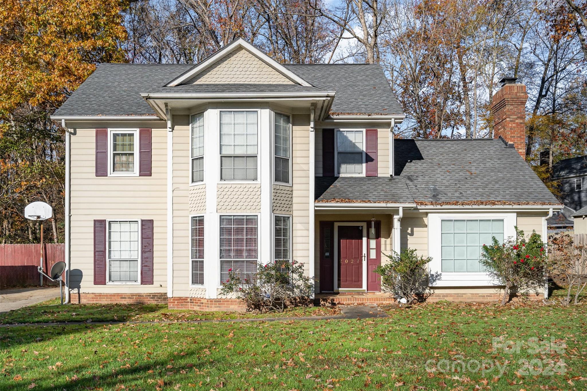 front view of a house with a yard