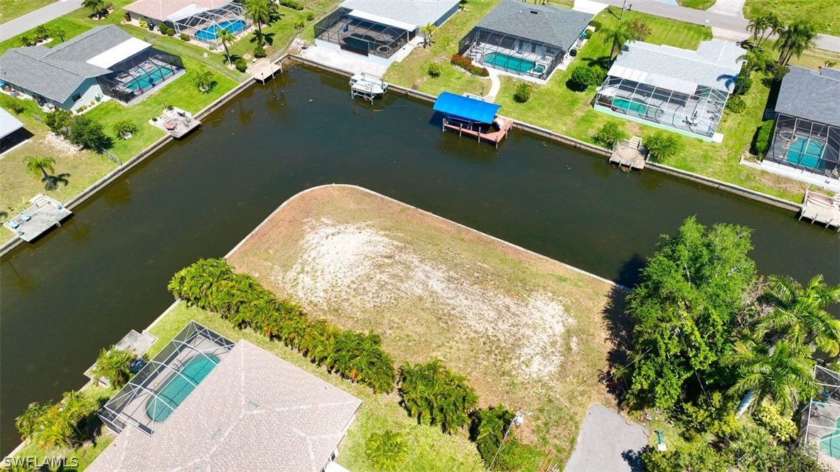 an aerial view of a house with a lake view