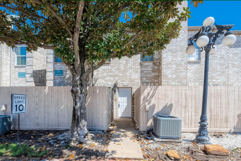 a view of a house with a yard and tree s