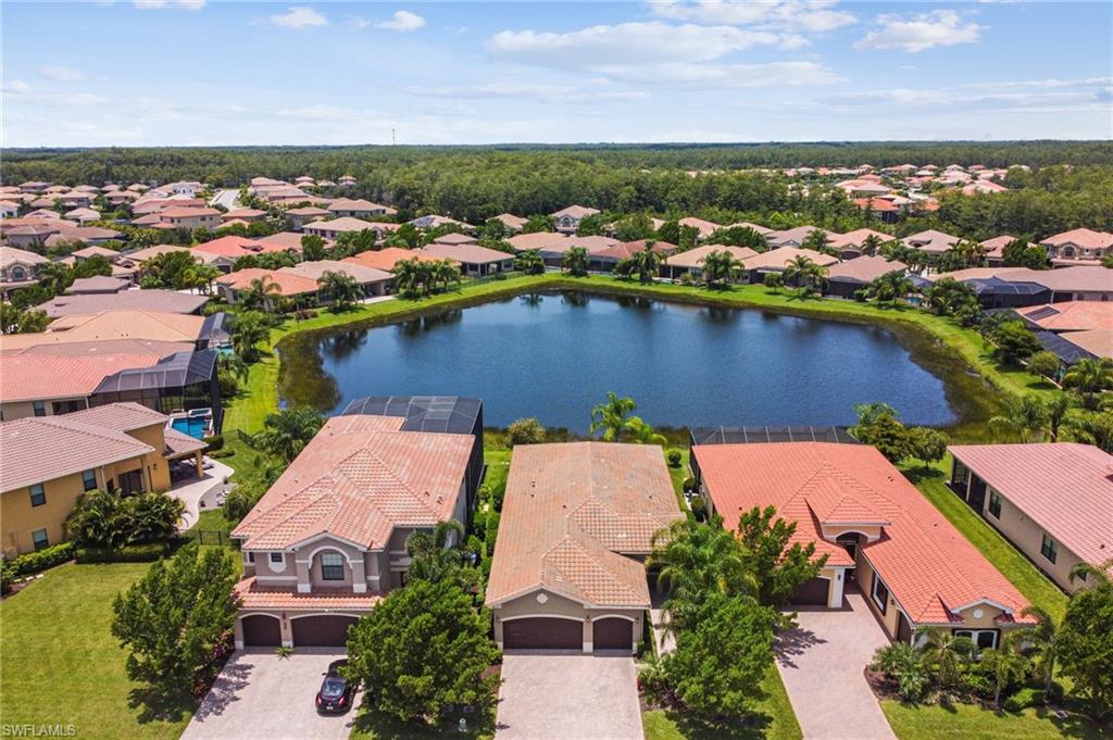 an aerial view of a house with a lake view