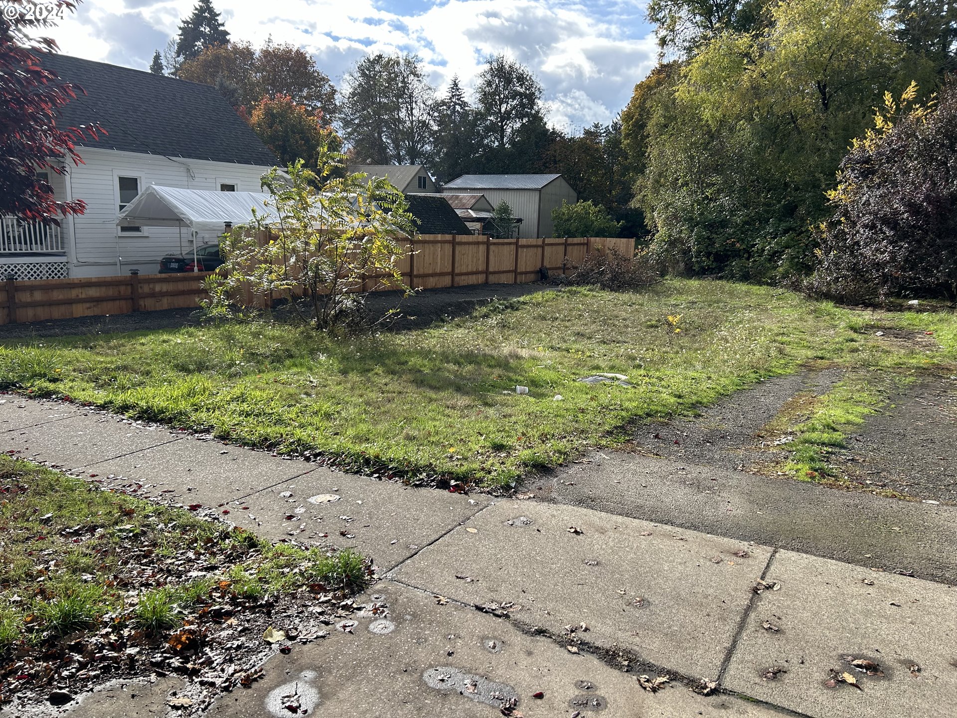 a backyard of a house with lots of green space