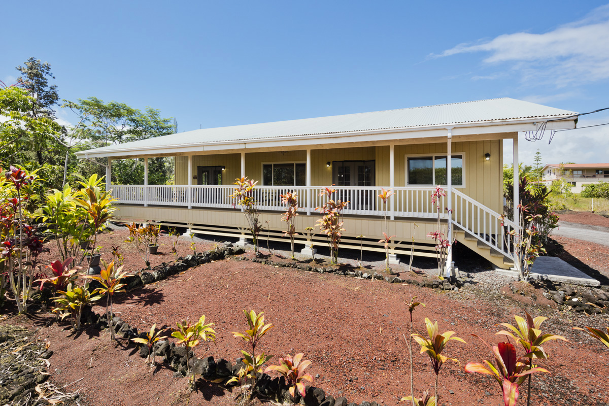 a house view with a sitting space and garden space