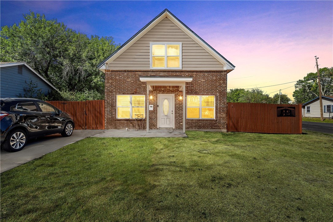 a view of a house with a back yard