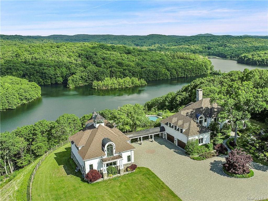 a view of a lake with a house in the background