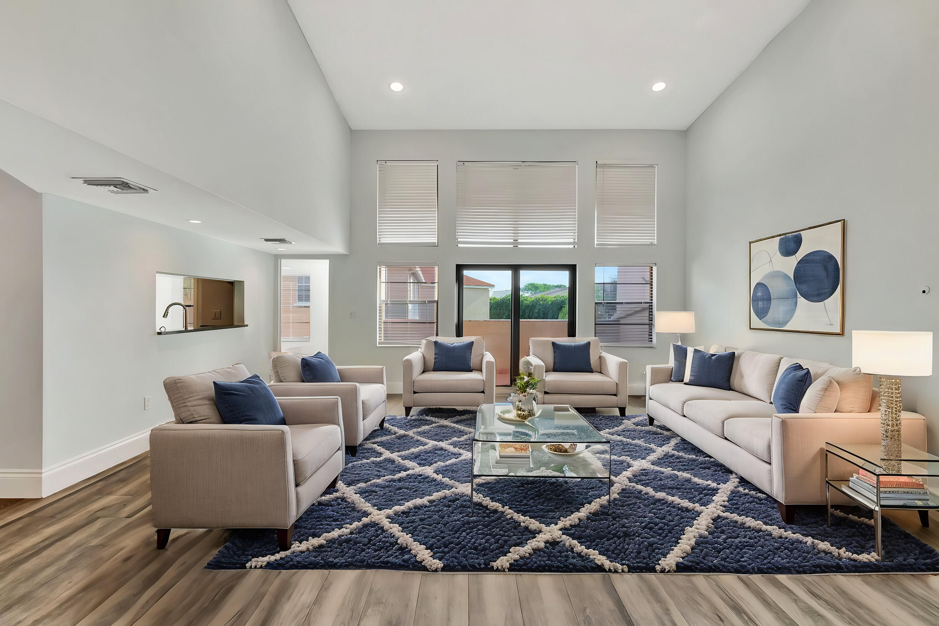 a living room with furniture or couch and a large window