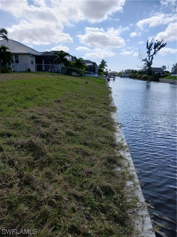 a view of a lake with a yard