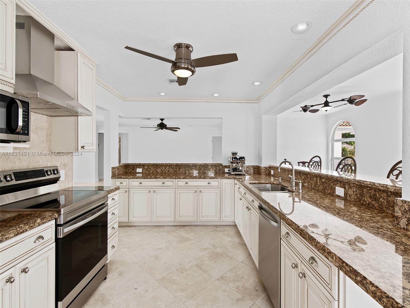 a large kitchen with a stove top oven