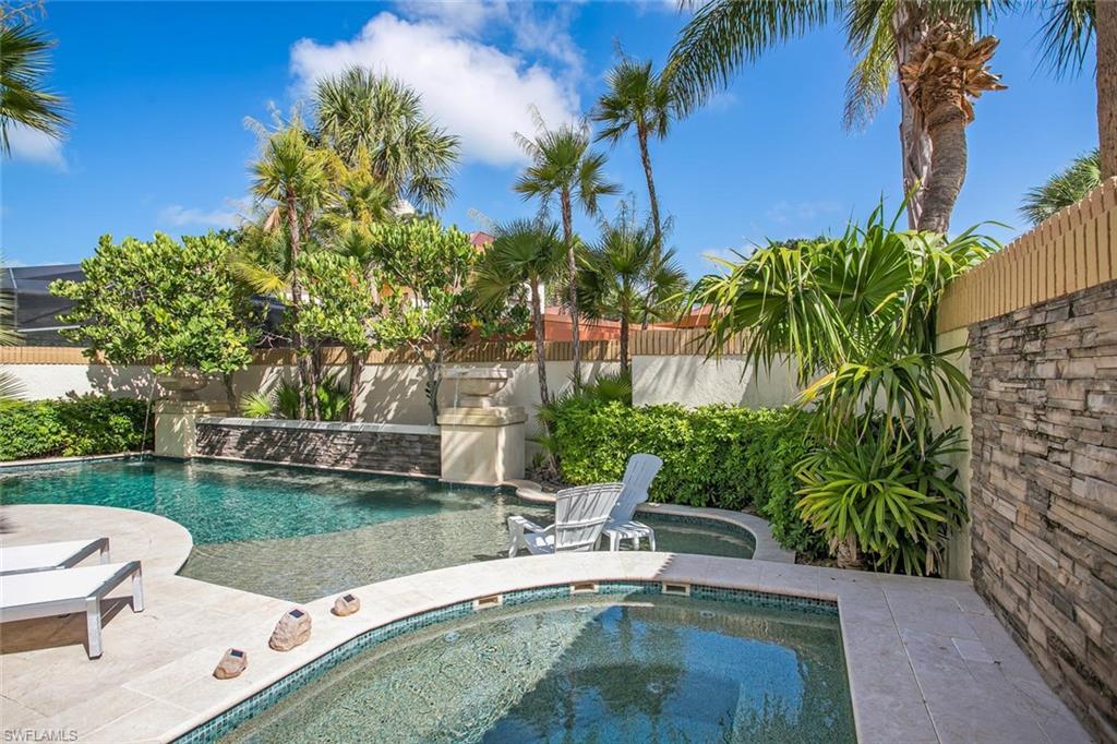 a view of a backyard with a patio and plants