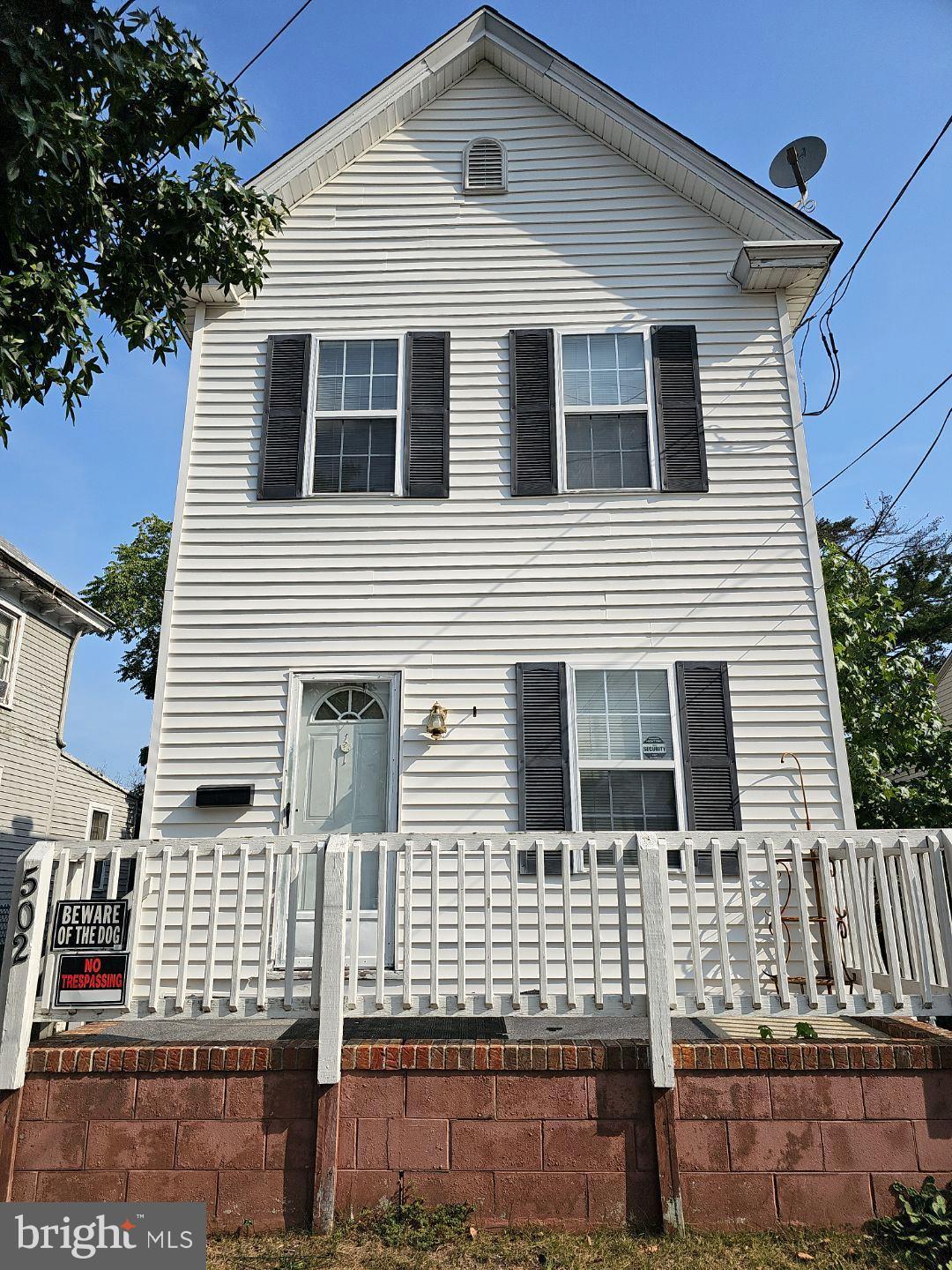 a front view of a house with garage