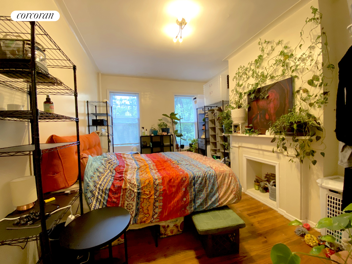 a bed room with a bed furniture and a flat screen tv