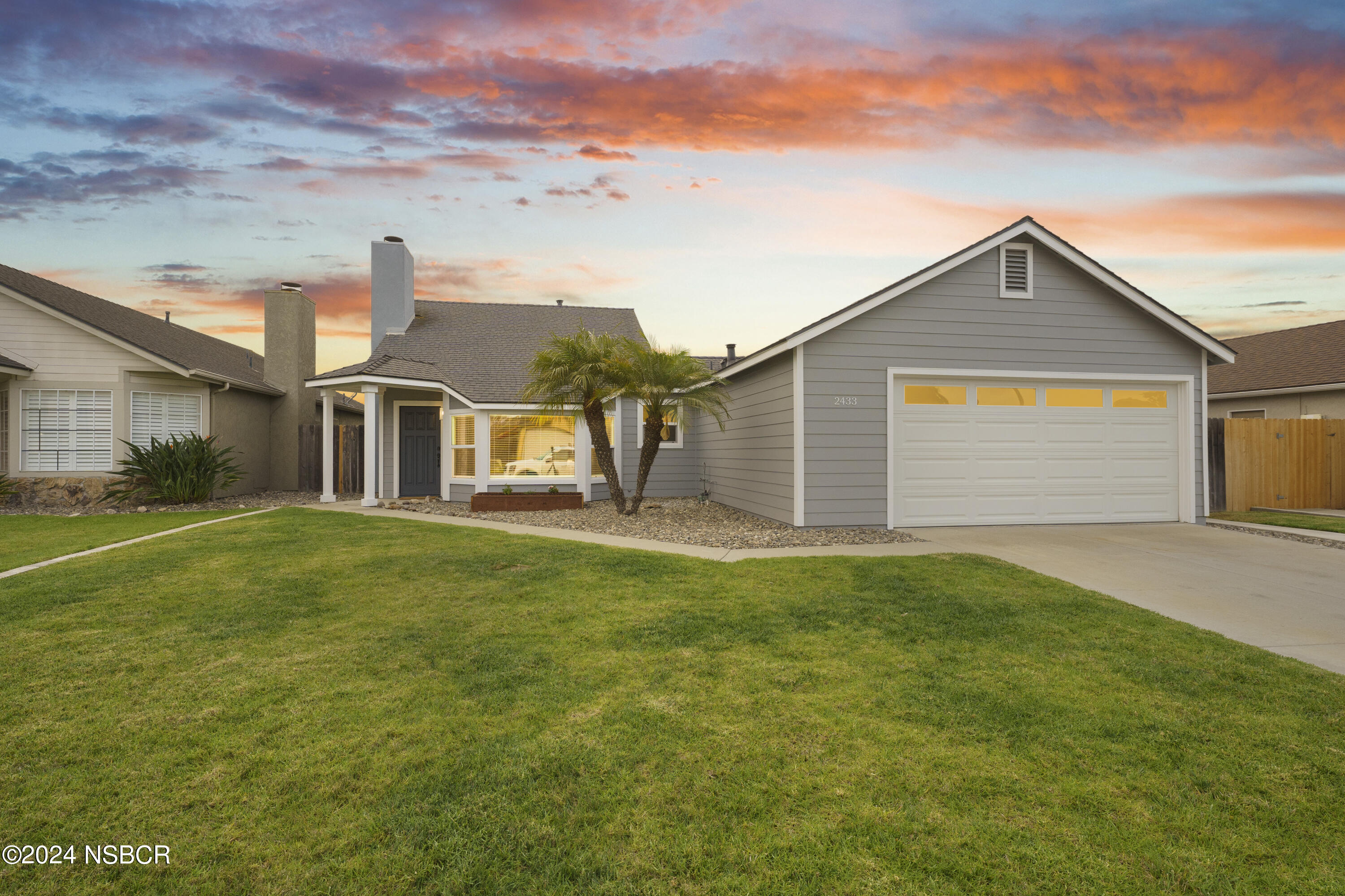 a view of a yard in front of a house