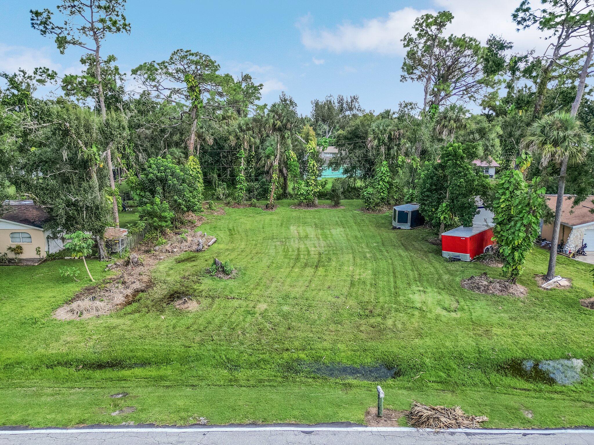 a backyard of a house with lots of green space