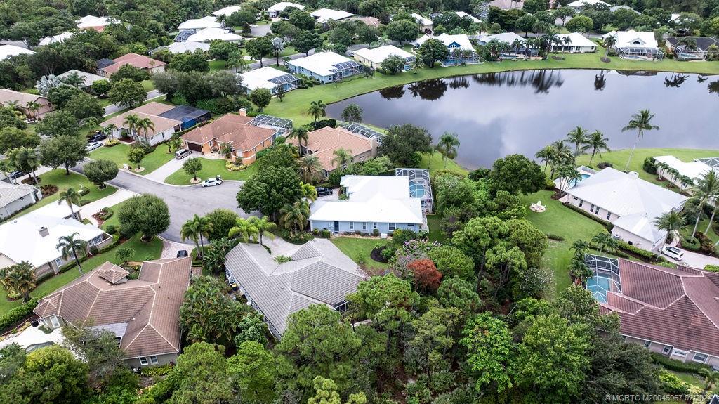 an aerial view of a houses with outdoor space and lake view