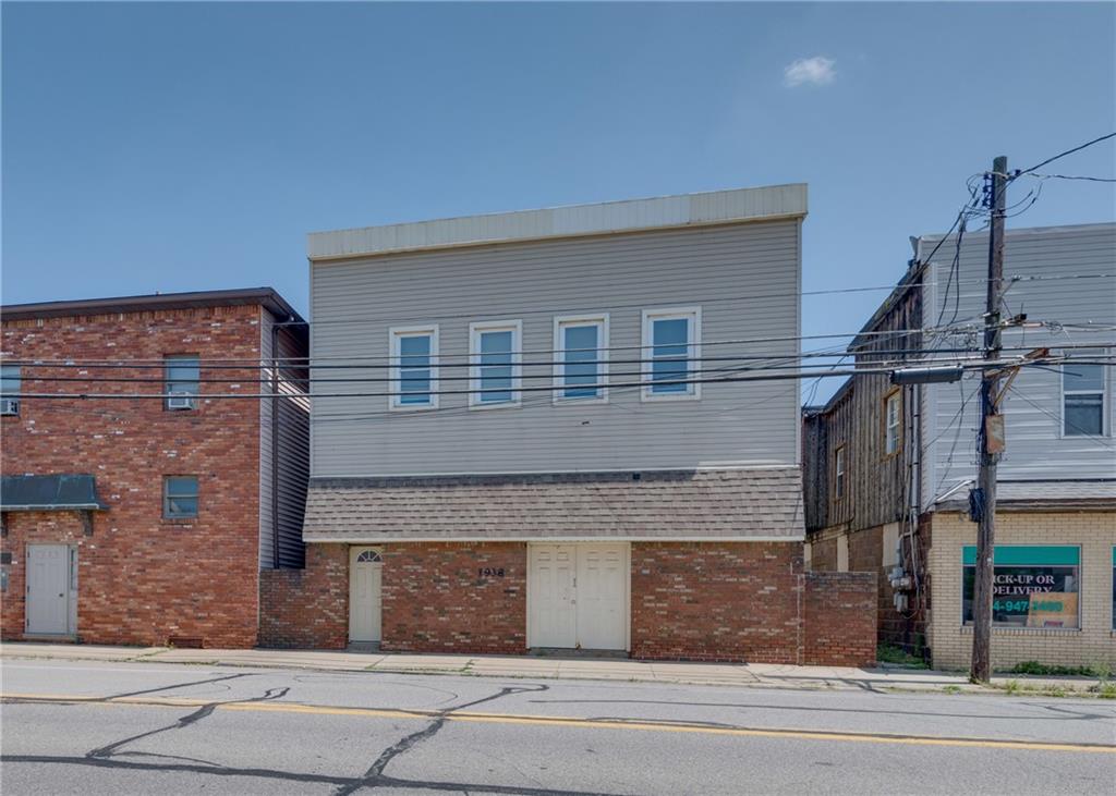 a front view of a house with a garage