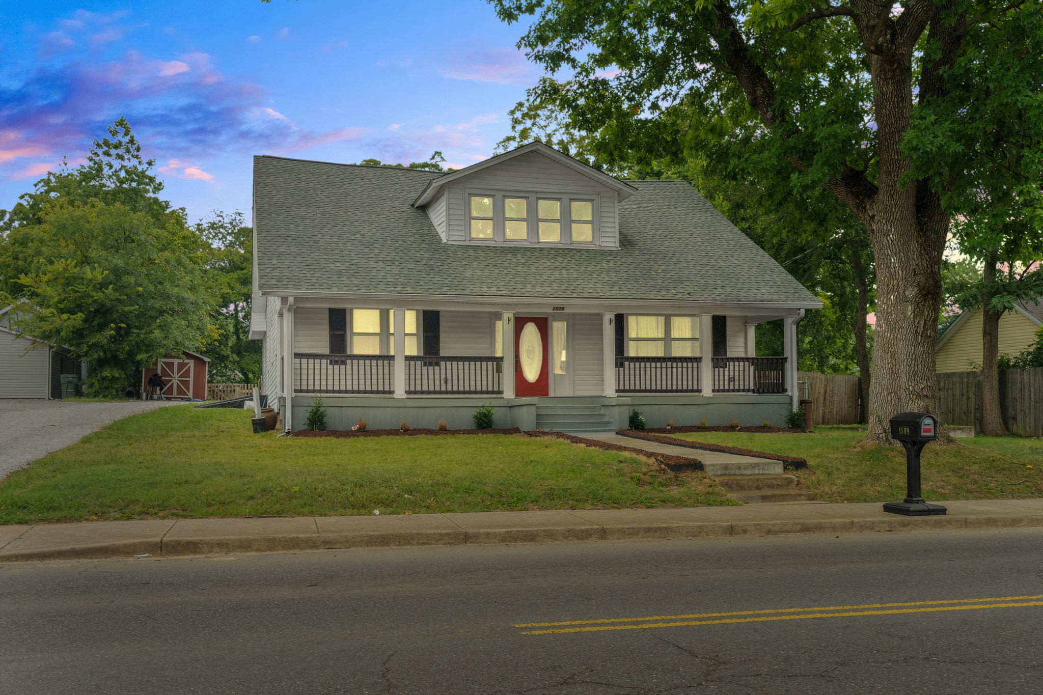 a front view of a house with garden