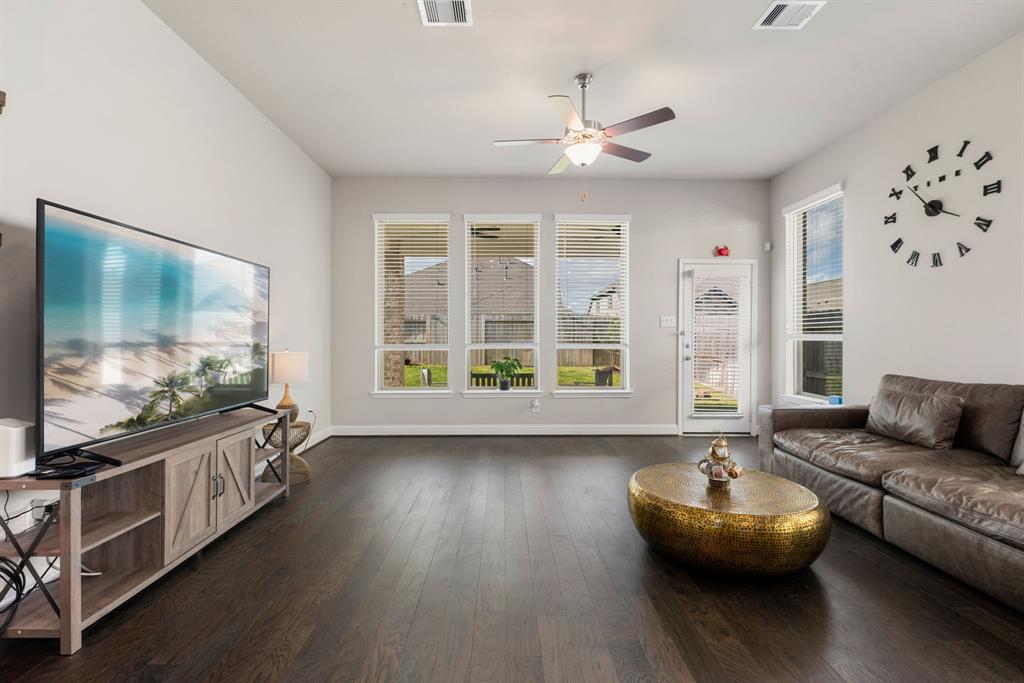 Welcome! Bright and spacious living room with large window