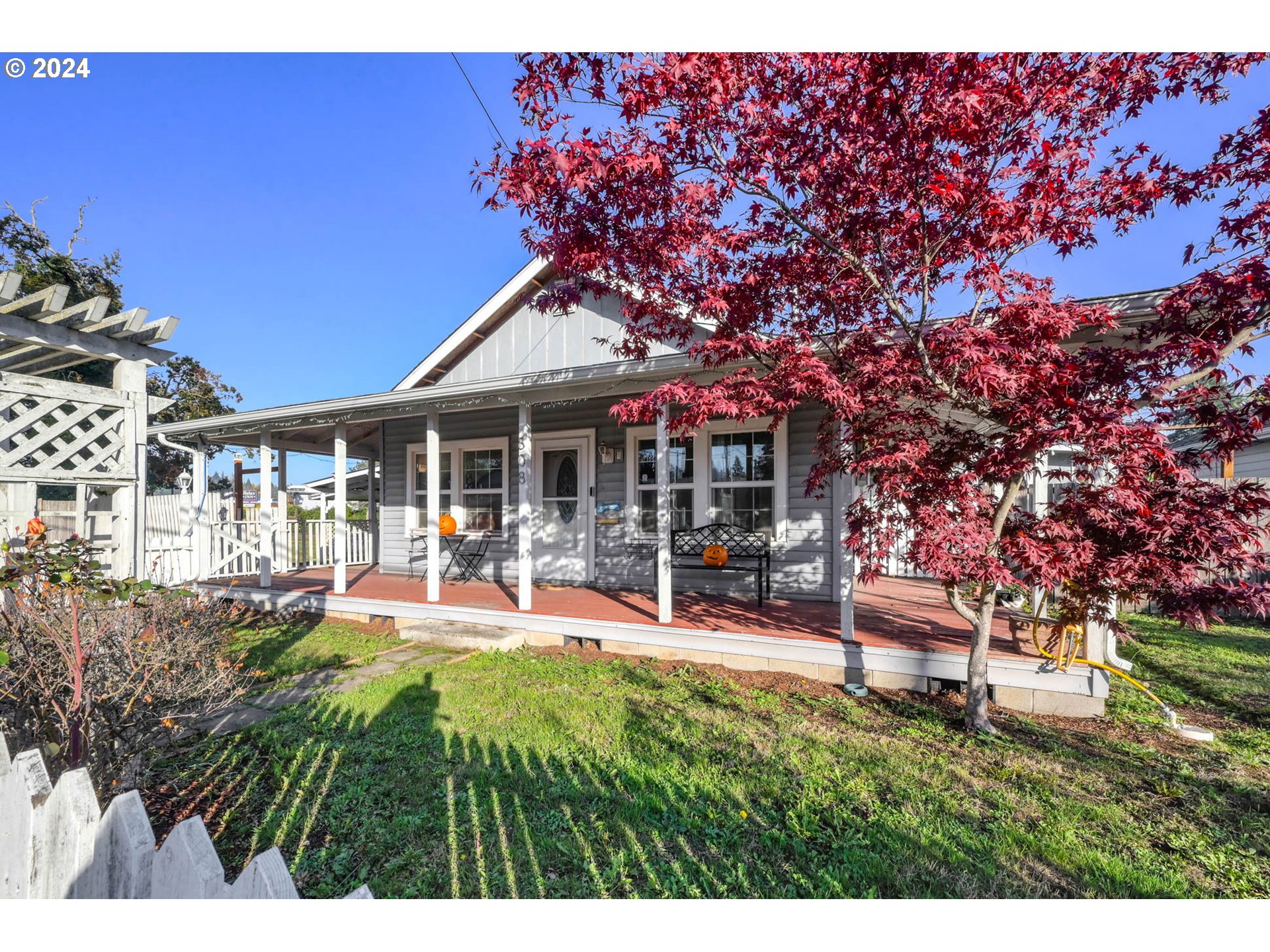 a view of a house with backyard porch and sitting area