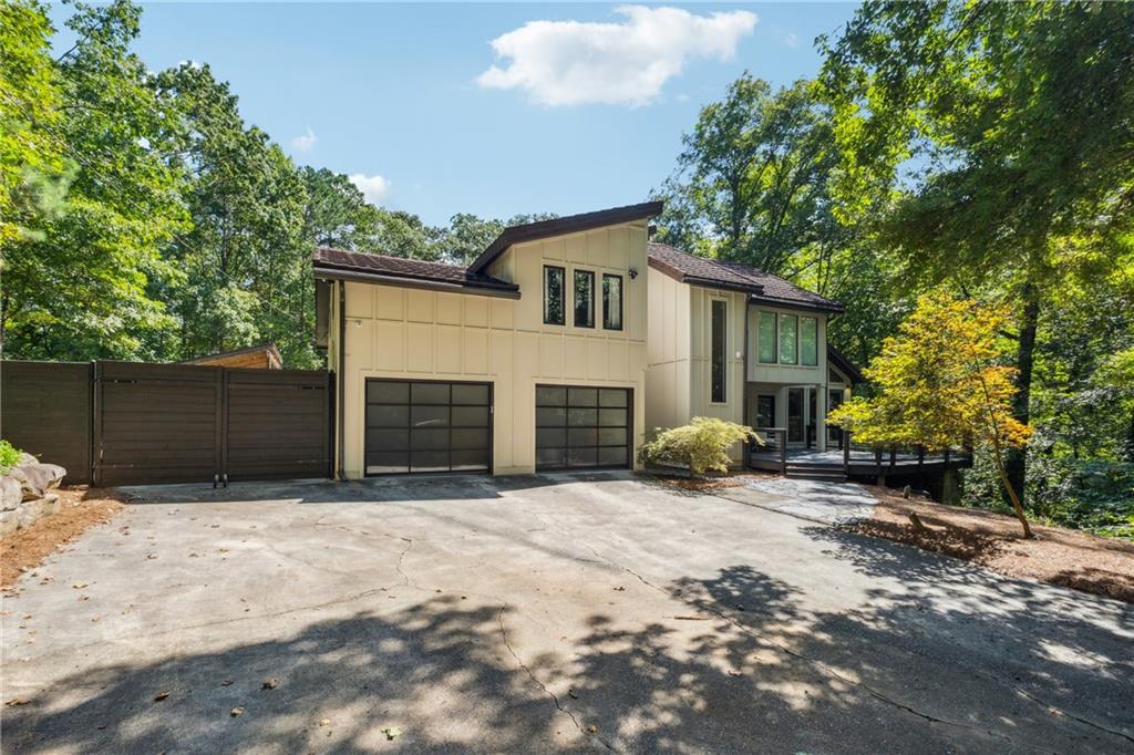 a view of a house with a yard and garage